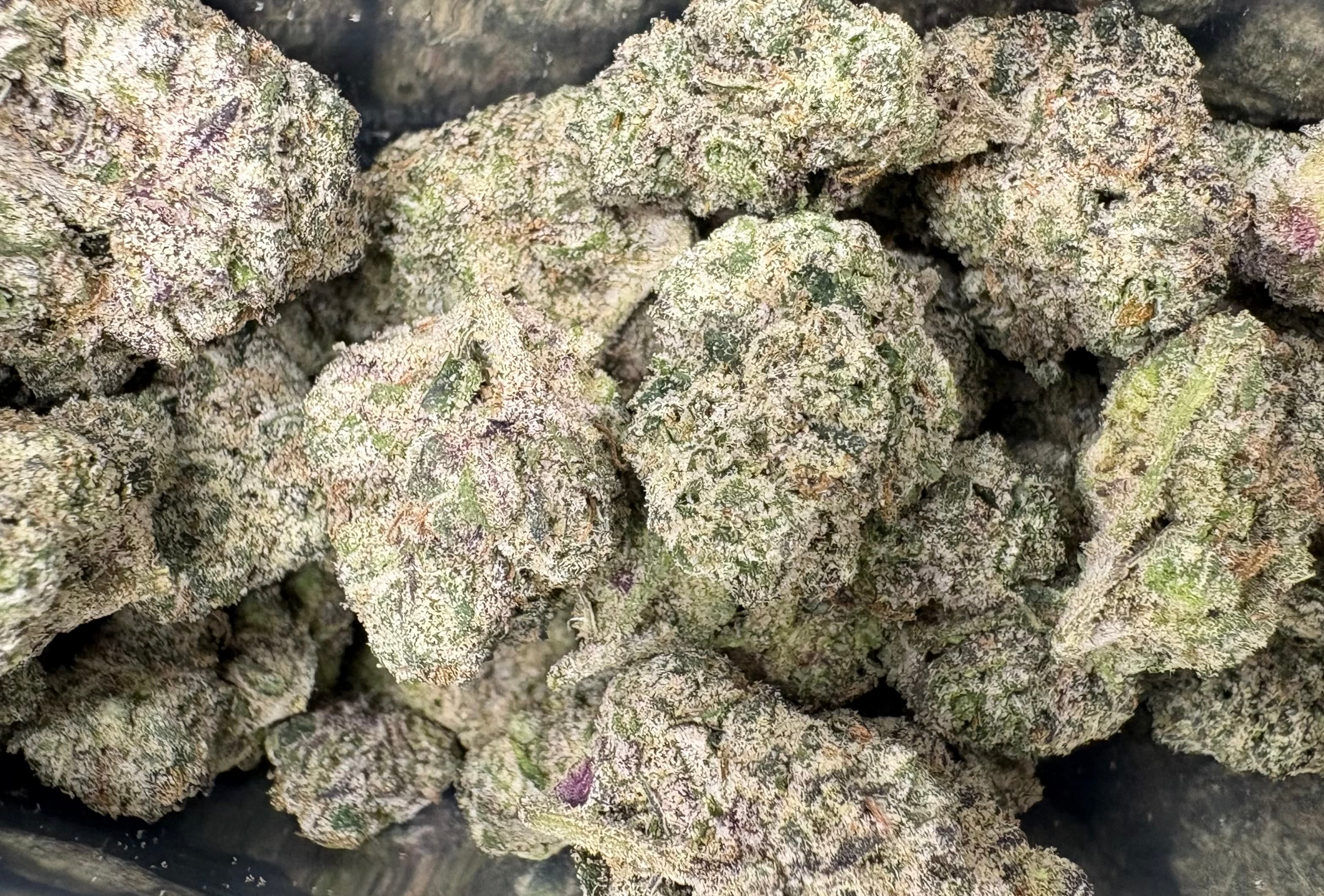 Various types of THCA flower products including indoor popcorn buds and greenhouse flower showing the selection available